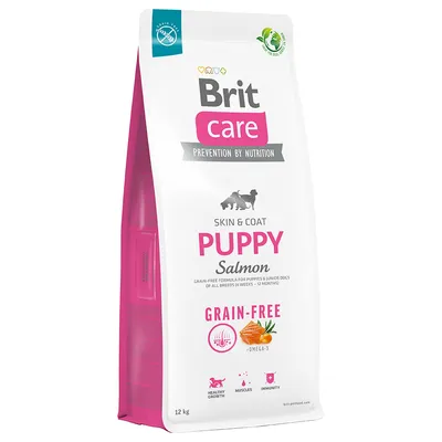 Sac Brit Care Skin & Coat Puppy Salmon, Grain-Free, 12 kg. Texte visible : Prevention by Nutrition, Omega-3, Healthy Growth, Muscles, Immunity. Illustration de saumon et carotte.