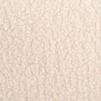 Nahaufnahme von beigem, weichem Fleece-Material mit strukturierter Oberfläche.