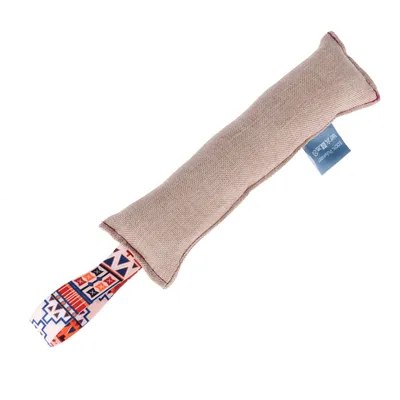 Beige fabric toy with coloured ribbon and care label. Rectangular shape, suitable for interactive play.