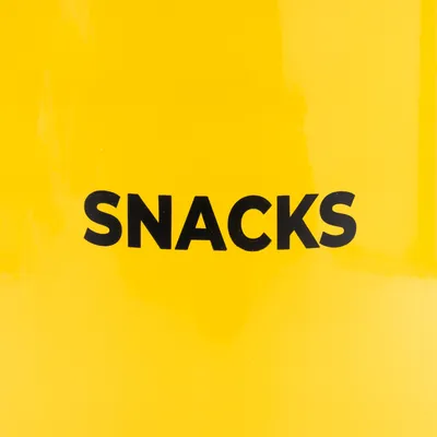 Yellow background with black text 'SNACKS'.