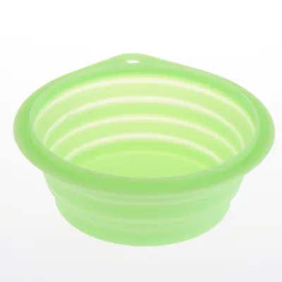 Green, foldable silicone bowl with ribbed sides and hanging hole.
