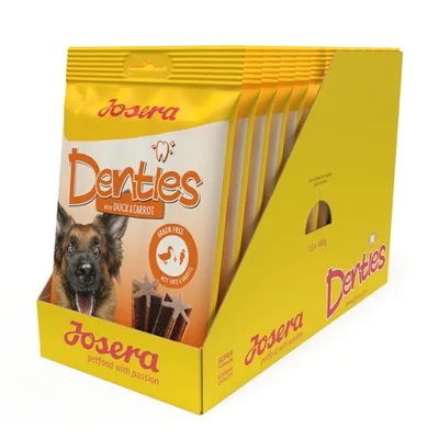 Josera Denties met eend en wortel, graanvrij. Verpakking toont hond en stervormige snacks. Verpakkingsgrootte: 13 x 180g.