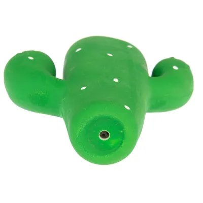 Grön kaktusformad leksak med vita prickar och en öppning på undersidan.