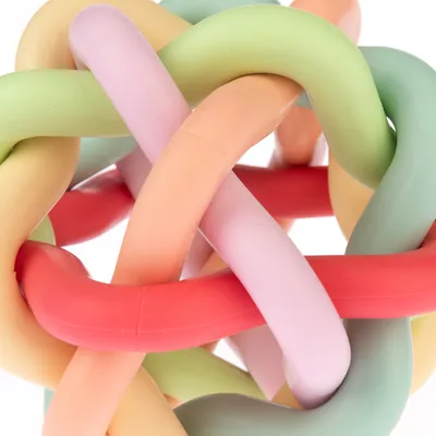 Colourful knot ball made of flexible, interwoven plastic tubes in pastel colours.