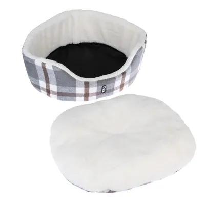 Round pet bed with removable white cushion. Outer material chequered in grey, brown and white. Black lining inside. Trixie brand visible on the side.