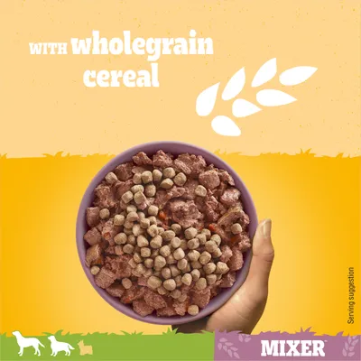 Bowl of pet food mixer with wholegrain cereal, shown as a serving suggestion. Text reads 'with wholegrain cereal'.
