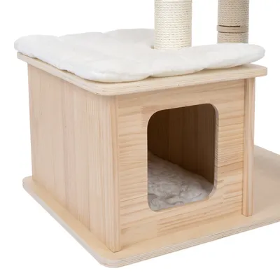 Cat tree base made of wood with cave, white padded lying cushion and two sisal posts.