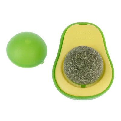 Jouet en forme d’avocat avec balle centrale grise et coque verte, inscription visible : TOYS avocado. Deux parties distinctes montrées.