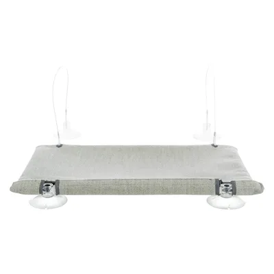 Plateforme rectangulaire grise en tissu avec quatre ventouses transparentes pour fixation sur une surface lisse, sans autres éléments visibles.
