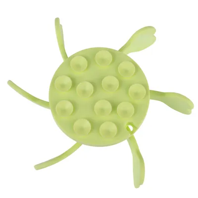 Green turtle-shaped toy with suction cups on the top and flexible legs.