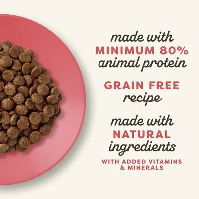 Kibble on a plate with text: made with minimum 80% animal protein, grain free recipe, made with natural ingredients, with added vitamins and minerals.