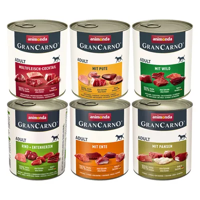 Six tins of animonda GranCarno Adult dog food, visible flavours: Multifleisch-Cocktail, Mit Pute, Mit Wild, Rind + Entenherzen, Mit Ente, Mit Pansen. 100% frische Zutaten on each label.