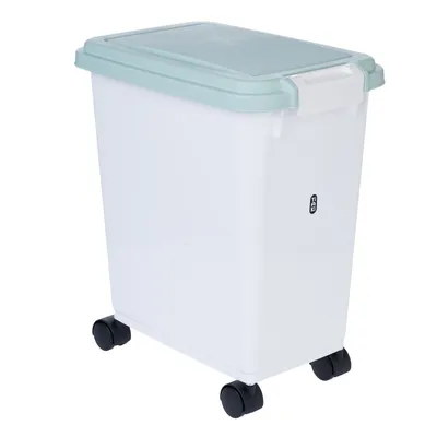 Valkoinen muovisäiliö, jossa vihreä kansi, pyörät ja kahva. Sivulla näkyvä 12 kg:n tilavuus.