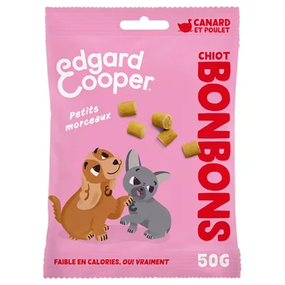 Edgard Cooper Chiot Bonbons, goût canard et poulet, petits morceaux, faible en calories, 50g. Emballage avec illustrations de deux chiens.