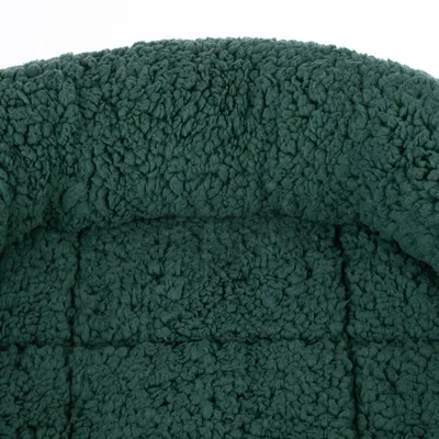 Close-up of a dark green, soft fabric with a textured surface, suitable for upholstery or pet bed.