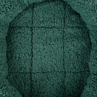 Close-up of green, soft plush material with textured surface.