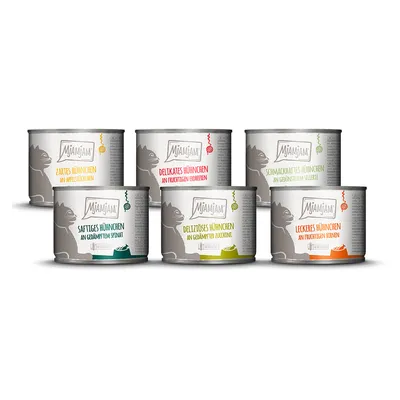 Lot de 6 boîtes MjAMjAM pour chat, variantes visibles : poulet avec pommes, fraises, céleri, épinards, courgettes ou poires. Étiquettes en allemand.