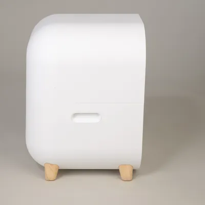 White container with rounded corners and wooden feet, side handle opening visible.