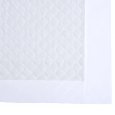 Vue rapprochée d’un tapis absorbant blanc avec surface gaufrée et bordure épaisse, matériau textile visible.