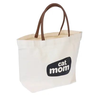 Bézs vászontáska barna fogantyúkkal és fekete 'cat mom' felirattal.