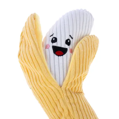 Leksak i form av en gul banan med leende ansikte, tillverkad av mjukt tyg.