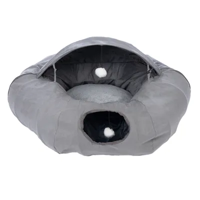 Grey, cave-shaped pet bed with soft inner padding and two white play balls on strings. Entrance visible at the front.