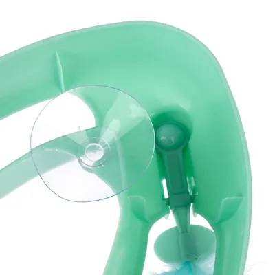 Jucărie din plastic verde cu ventuză și mecanism cu arc integrat.