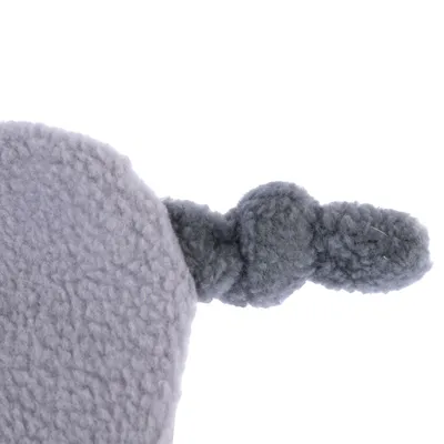 Close-up of a grey, soft fabric toy with knotted structure.