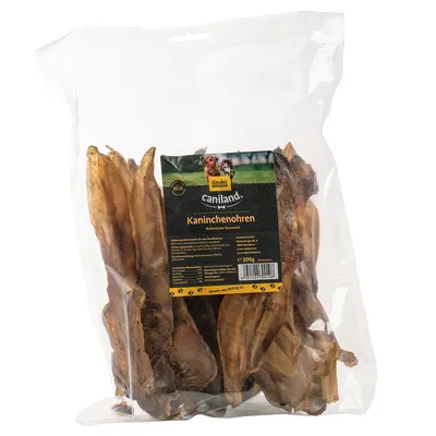 Caniland orecchie di coniglio, snack da masticare naturale, 200g. Alimento complementare per cani, prodotto da deuka. Confezione con sacchetto trasparente ed etichetta del prodotto.