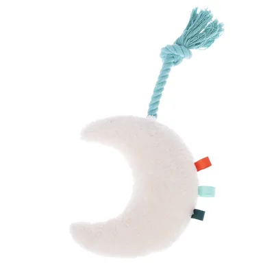 Toy in moon shape made of white plush with turquoise cord and colourful fabric tabs.