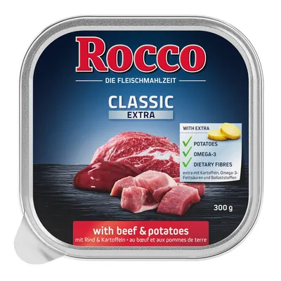 Консерва Rocco Classic Extra 300 г, с изображением кусков говядины и картофеля. Видны надписи: with beef & potatoes, potatoes, omega-3, dietary fibres.