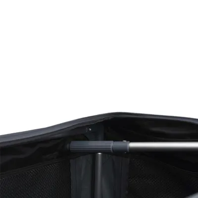 Interior view of a carrier or trolley showing mesh pockets and a metal support bar, highlighting storage space and construction details.