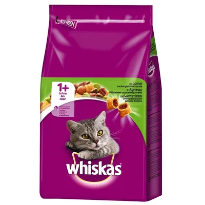 Whiskas суха храна за котки 1+ години, изображение на сива котка и гранули, текст: mit Lamm, 100% komplett, zip fresh опаковка.