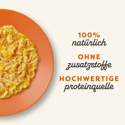 100% natürlich, ohne Zusatzstoffe, hochwertige Proteinquelle. Abgebildet ist ein Teller mit zerkleinertem gelbem und weissem Futter.
