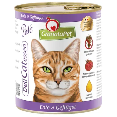 Lata de paté GranataPet DeliCatessen para gatos, sabor pato y ave. Texto visible: 'Ohne Getreide', 'Granatapfelkerne', 'Lachsöl'. Imagen de un gato en la etiqueta.