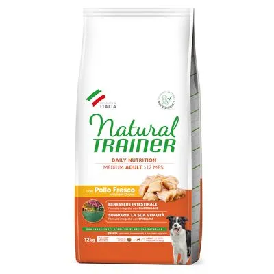 Zak Natural Trainer Daily Nutrition Medium Adult >12 Mesi, met Pollo Fresco, 12 kg. Tekst: Benessere intestinale, Supporta la sua vitalità. Hond en kipstukjes zichtbaar op verpakking.