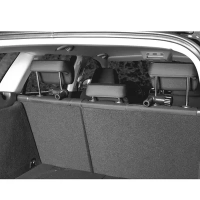 Rear view of a car with headrests and mounted brackets for a safety grille. Suitable for separating boot and passenger compartment.