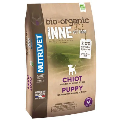 Sac de croquettes NUTRIVET bio-organic INNE PET FOOD pour chiot, 0 % céréales ajoutées, fabrication française, volaille, pour chiot du sevrage à 2 ans. Texte en français et anglais visible.