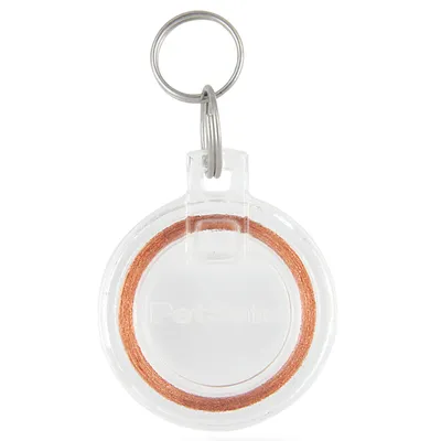 Round transparent keyring tag with visible copper coil inside, designed for attachment to a collar or keychain.