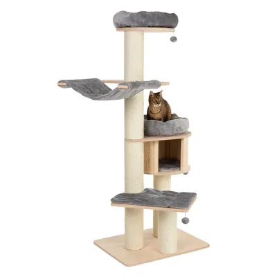 Cat tree made of wood with sisal posts, grey resting surfaces, hammock and cave. Cat sitting on one of the padded levels.