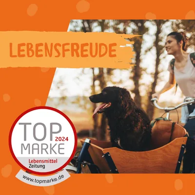 Top Marke 2024 von Lebensmittel Zeitung. Lebensfreude mit Hund in Fahrradkorb. www.topmarke.de.