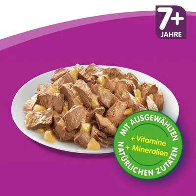 Krožnik z mesnimi kosi v omaki, oznaka 7+ Jahre in okrogel znak z besedilom MIT AUSGEWÄHLTEN NATÜRLICHEN ZUTATEN + Vitamine + Mineralien.