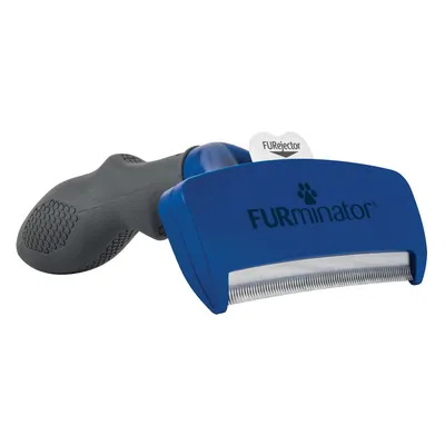 Cepillo azul con mango negro y púas metálicas, marca FURminator visible en el cabezal. Texto 'FURejector' en la pestaña superior.
