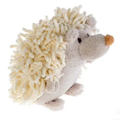 Jouet pour chien en forme de hérisson, tissu beige et crème, museau orange, surface texturée avec poils bouclés sur le dos. Aucune marque visible.