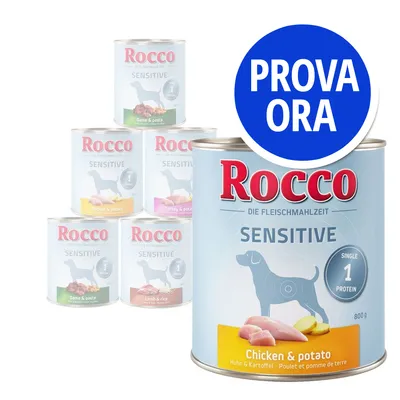 Rocco Sensitive, lattine da 800 g con vari gusti visibili: Chicken & potato, Game & pasta, Turkey & potato, Lamb & rice. Etichetta blu con scritta 'PROVA ORA' in alto a destra.