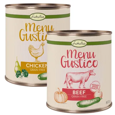 Dos latas Lukullus Menu Gustico: una con texto 'Chicken Grain-Free' y dibujos de pollo, brócoli y calabacín; otra con 'Beef Grain-Free', vaca, calabaza y calabacín. 800 g.