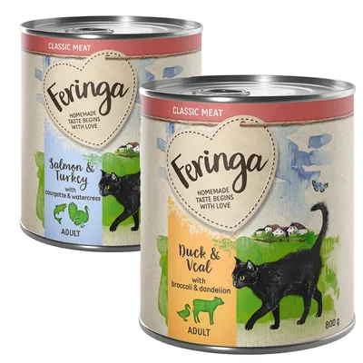 Dos latas de comida para gatos Feringa Classic Meat: una de salmón y pavo con calabacín y berro, otra de pato y ternera con brócoli y diente de león. Ambas para gatos adultos, 800 g.