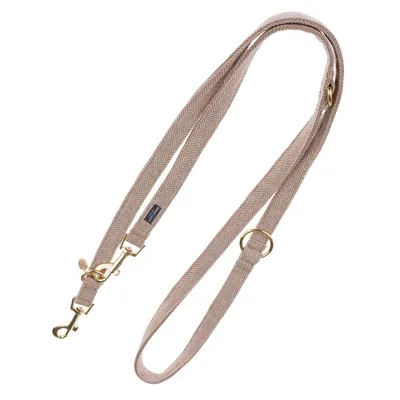 Beige hundesnor med guldfarvede metalclips og ringe, sildebensmønster, synligt mærketikette.