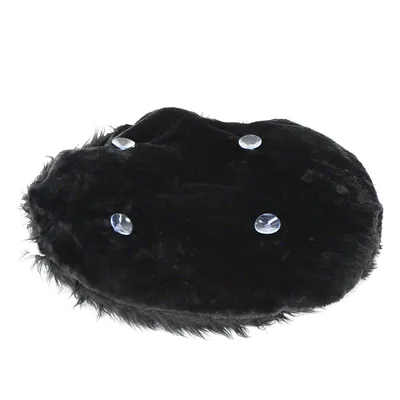 Black, oval cushion with soft fur cover and four transparent buttons on the top.