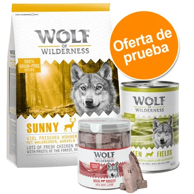 Pack de prueba Wolf of Wilderness: saco Sunny, lata Green Fields y bote High Valley. Etiquetas visibles: 100% grain-free recipe, lots of fresh chicken meat, freeze dried, 100% beef liver.